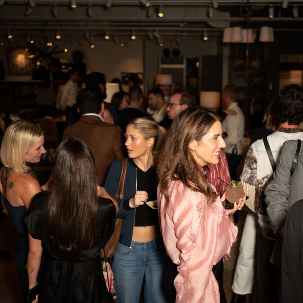 Guests mingling inside HW Home during the grand opening evening